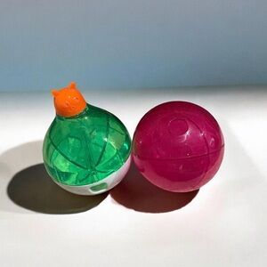 Two Green & Pink Spinning Treat Capsule Dispensers for Cats